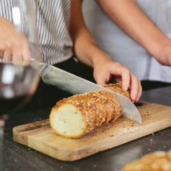 Alpha-Royal Japanese Serie 8" Brotmesser 18° Wellenschliff Damaszener-Stahl -Haushaltsgeräte Geschäft 10038985 de 0003 logo